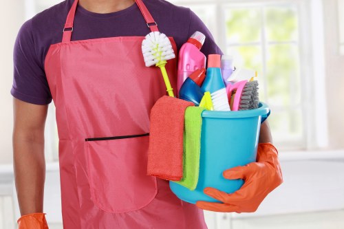 Domestic cleaner working in a Shoreditch apartment kitchen